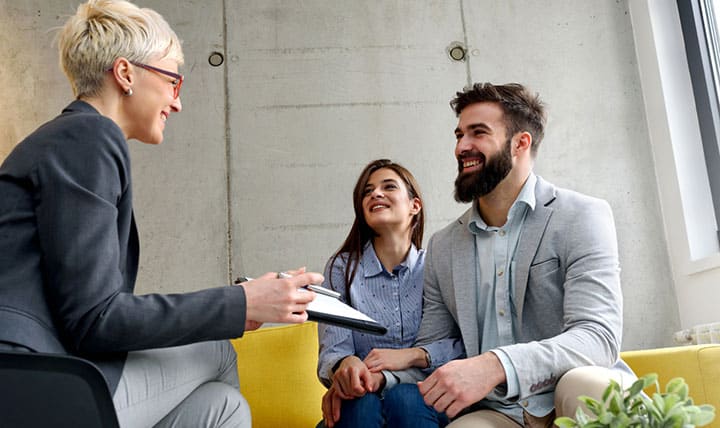 Therapist meets with couple for marriage counseling.