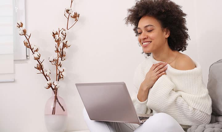 Therapist meets with patient in online with laptop.